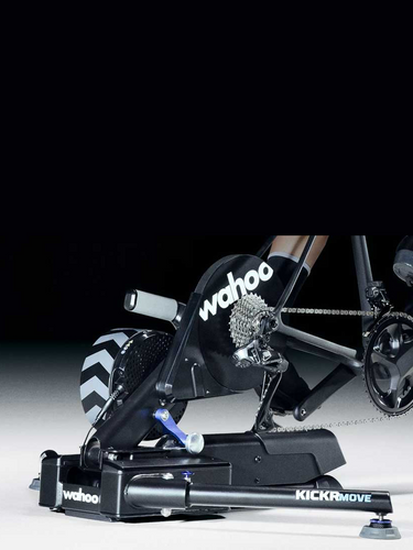 Wahoo Kickr Move indoor smart trainer machine on white and black background